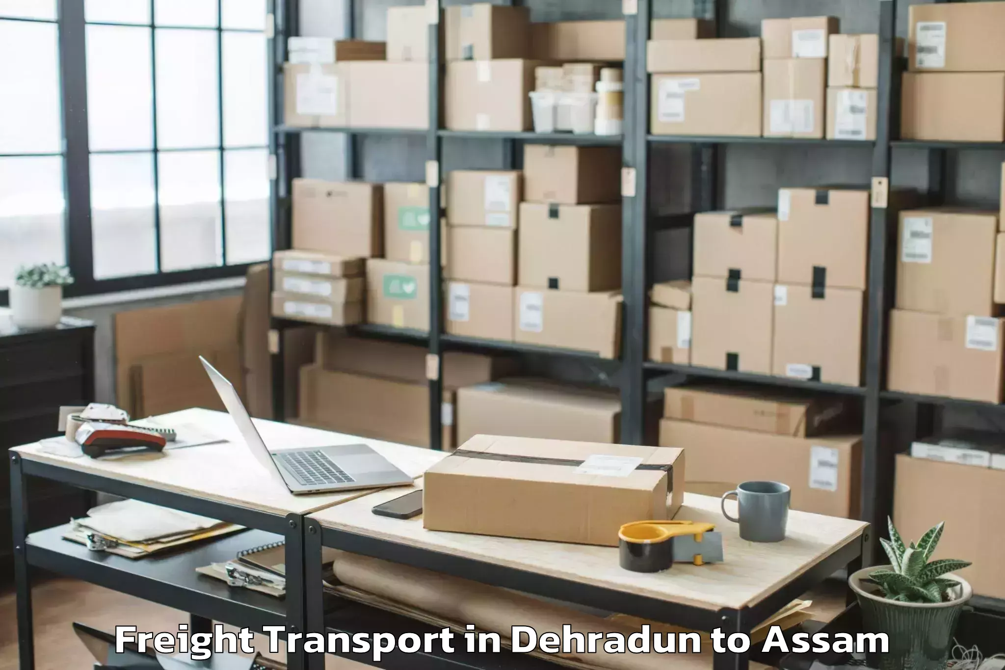 Affordable Dehradun to Nowgong Freight Transport